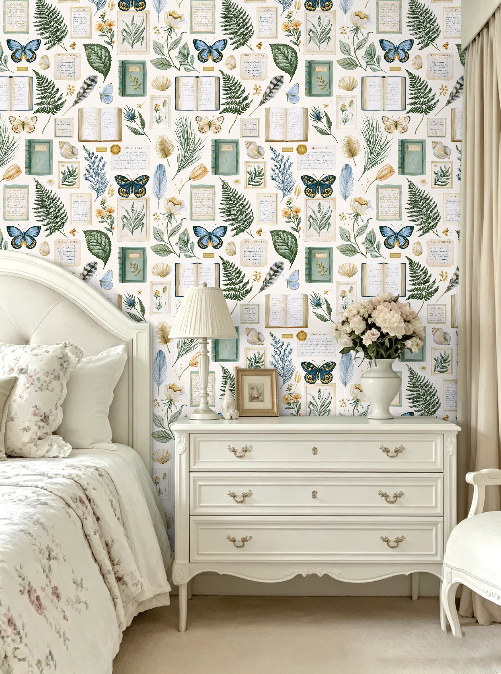 Vintage book‑print wallpaper for charming cottage bedroom vanity nook