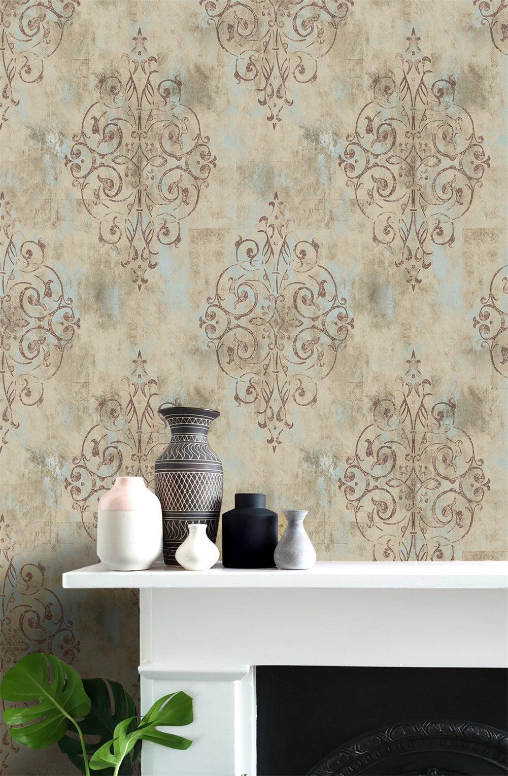 Living room fireplace wall decorated with distressed damask removable wallpaper, muted neutral vintage wall art